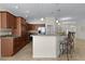 Kitchen with breakfast bar, stainless steel appliances, and tiled backsplash at 2017 Royal Elm Rd, The Villages, FL 32162