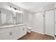 Modern bathroom with double vanity and walk-in shower at 202 Shannon Ln, Lady Lake, FL 32159