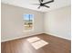 Well-lit bedroom with hardwood floors and a window at 202 Shannon Ln, Lady Lake, FL 32159