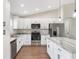 Modern kitchen with stainless steel appliances and granite countertops at 202 Shannon Ln, Lady Lake, FL 32159