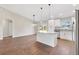 Open concept kitchen and dining area with hardwood floors at 202 Shannon Ln, Lady Lake, FL 32159