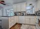 White kitchen with corner sink and ample counter space at 2156 Cr 437A, Lake Panasoffkee, FL 33538