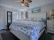 Main bedroom with ceiling fan and large dresser at 2156 Cr 437A, Lake Panasoffkee, FL 33538