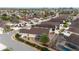 Aerial view of a house with a screened-in patio, pool, and landscaping at 2222 Southwood Dr, The Villages, FL 32162