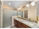 Bathroom boasts double vanity and granite countertops at 2222 Southwood Dr, The Villages, FL 32162