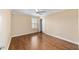 Bedroom featuring wood floors and window shutters at 2222 Southwood Dr, The Villages, FL 32162