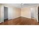 Bedroom with wood floors and walk-in closet at 2222 Southwood Dr, The Villages, FL 32162