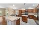 Open concept kitchen with large island and granite countertops at 2222 Southwood Dr, The Villages, FL 32162