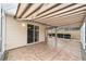 Covered patio with striped awning and fan at 2222 Southwood Dr, The Villages, FL 32162