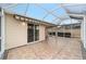 Covered patio with awning and screened enclosure at 2222 Southwood Dr, The Villages, FL 32162