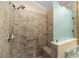 Large walk-in shower with tiled walls and seat at 2222 Southwood Dr, The Villages, FL 32162