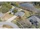 Beautiful aerial view of a screened in pool and landscaping at 225 Sutherland Ct, Apopka, FL 32712