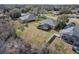 Aerial view of a home with screened in pool at 225 Sutherland Ct, Apopka, FL 32712