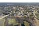 Aerial view of homes in a wooded suburban neighborhood at 225 Sutherland Ct, Apopka, FL 32712