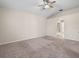 Neutral bedroom features carpet, overhead fan, and an archway leading to the Primary bathroom at 225 Sutherland Ct, Apopka, FL 32712