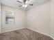 Bright bedroom with a neutral carpet, a window, and a ceiling fan at 225 Sutherland Ct, Apopka, FL 32712