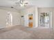 Spacious bedroom featuring neutral paint, ceiling fan, and sliding glass doors to screened lanai at 225 Sutherland Ct, Apopka, FL 32712