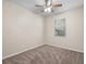 Bright bedroom with a neutral carpet, a window, and a ceiling fan at 225 Sutherland Ct, Apopka, FL 32712