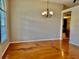 Dining room with hardwood floors and chandelier at 225 Sutherland Ct, Apopka, FL 32712