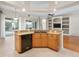 Kitchen featuring a breakfast bar with granite countertops, stainless steel appliances, and pantry at 225 Sutherland Ct, Apopka, FL 32712