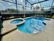 Inviting pool and spa area with screened enclosure at 225 Sutherland Ct, Apopka, FL 32712