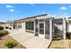 This patio features a concrete foundation, room for outdoor seating and a view of the back yard at 2303 Nehaul Ter, The Villages, FL 32162