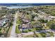 Aerial view of a residential street showing tree-lined roads and landscaping at 2384 Orange Capital Ct, Eustis, FL 32726