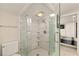 Bathroom featuring a glass enclosed shower and tile surround at 2384 Orange Capital Ct, Eustis, FL 32726