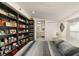 Bedroom with a gray striped comforter and decoratively stocked shelves at 2384 Orange Capital Ct, Eustis, FL 32726