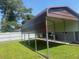 Durable metal carport providing ample covered parking for vehicles or outdoor equipment at 2384 Orange Capital Ct, Eustis, FL 32726