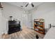 Bedroom with wood-look flooring and desk area at 24429 Adair Ave, Sorrento, FL 32776