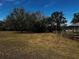 Expansive land with mature trees is ready for new construction at 24429 Adair Ave, Sorrento, FL 32776