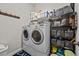 Laundry Room features a side-by-side washer and dryer and a wire shelf at 24429 Adair Ave, Sorrento, FL 32776