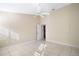 Bright bedroom with tile floors and access to bathroom at 25324 Hibiscus St, Leesburg, FL 34748