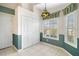 Bright breakfast nook with a stained-glass light fixture at 25324 Hibiscus St, Leesburg, FL 34748