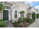 Inviting exterior with a dark green front door and well-manicured landscaping at 25324 Hibiscus St, Leesburg, FL 34748