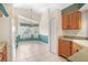 View of kitchen with wood cabinets and tile floor at 25324 Hibiscus St, Leesburg, FL 34748