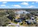 Aerial view showcasing home's location near a lake at 25547 Belle Helene, Leesburg, FL 34748