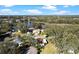 Aerial showcasing home near lake and trees at 25547 Belle Helene, Leesburg, FL 34748