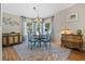 Dining room featuring a round table, updated light fixture and decorative rug at 25547 Belle Helene, Leesburg, FL 34748