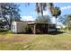 Single story home with covered porch and lush lawn at 25547 Belle Helene, Leesburg, FL 34748