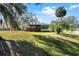 Single story home with covered porch and lush lawn at 25547 Belle Helene, Leesburg, FL 34748