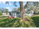 Single story home with covered porch and lush lawn at 25547 Belle Helene, Leesburg, FL 34748