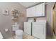 Laundry room with washer, dryer, and toilet at 25547 Belle Helene, Leesburg, FL 34748