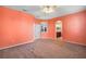 Bright bedroom with access to bathroom and ceiling fan at 27008 Camerons Run, Leesburg, FL 34748