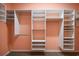 Large walk-in closet with custom shelving and hanging rods at 27008 Camerons Run, Leesburg, FL 34748