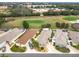 Aerial showing homes, golf course, and school at 2849 Leicester Ter, The Villages, FL 32162