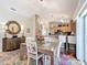 Kitchen and dining area with a chandelier and granite countertops at 2849 Leicester Ter, The Villages, FL 32162