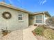 Front entry with landscaping and walkway at 2849 Leicester Ter, The Villages, FL 32162