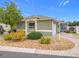 Single-story home with green exterior and landscaping at 2849 Leicester Ter, The Villages, FL 32162